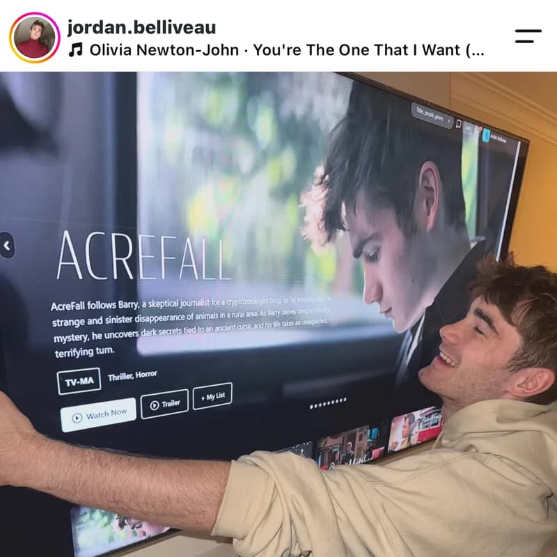 Filmmaker Jordan Belliveau hugging his television with AcreFall showing on CGP Spotlight